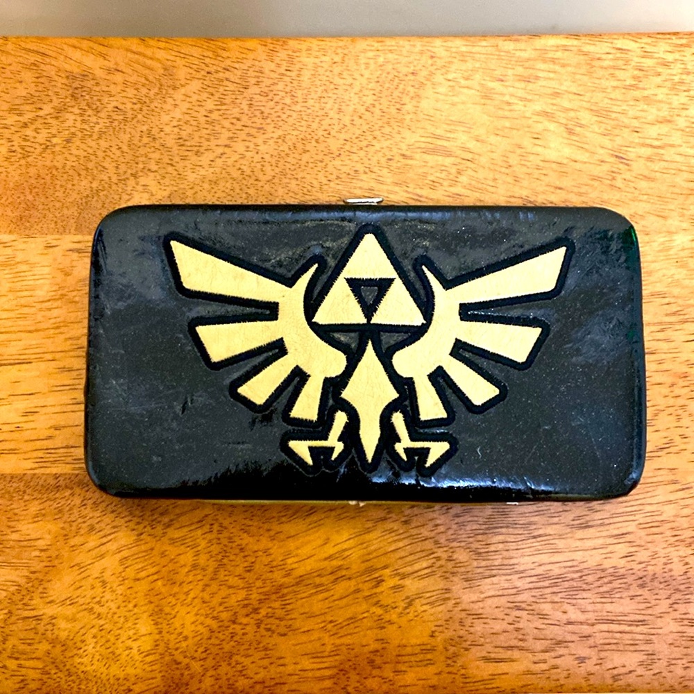 Nintendo Zelda wallet. Black with Gold color Zelda emblem. Pre-loved